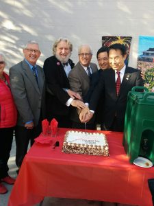 Delegates with the commemorative cake by Steveston Bakery