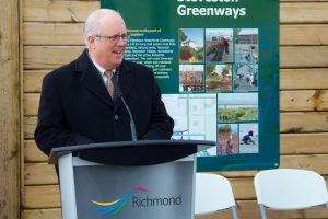 Mayor Malcolm Brodie speaks at the Mural Unveiling Event